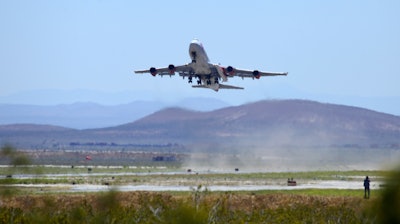 Virgin Orbit's 'Cosmic Girl' Boeing 747-400 takes off from Mojave Air and Space Port north of Los Angeles, May 25, 2020.