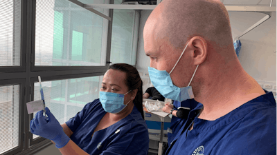 Technicians prepare for a clinical trial of a vaccine in Melbourne, Australia, May 26, 2020.