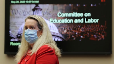 Loren Sweatt, Principal Deputy Assistant Secretary of Labor for OSHA, prepares to testify before a House Committee on Education and Labor Subcommittee on Workforce Protections hearing examining the federal government's actions to protect workers from COVID-19 on Thursday, May 28 on Capitol Hill in Washington.