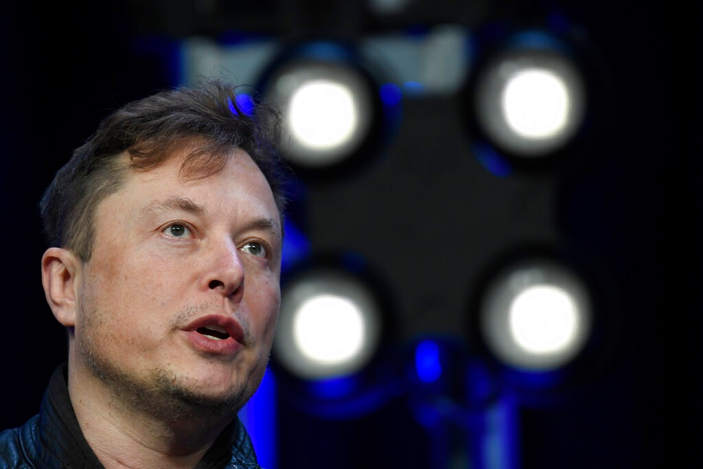 In this March 9, 2020, file photo, Tesla and SpaceX Chief Executive Officer Elon Musk speaks at the SATELLITE Conference and Exhibition in Washington. Musk is threatening to pull the company&rsquo;s factory and headquarters out of California in an escalating spat with local officials over reopening an electric vehicle plant. On Twitter Saturday afternoon, May 9, 2020. Musk also threatened to sue over Health Department coronavirus restrictions that have stopped Tesla from restarting production at its factory in Fremont south of San Francisco.