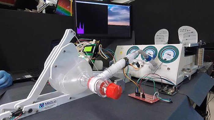 The UCSD MADVent Mark V is a ventilator built around a bag used by EMTs, which is pressed by a machined paddle. The ventilator was tested on a lung simulator (right in the back).