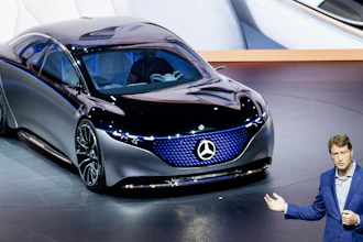 Ola Kaellenius, head of Mercedes-Benz, next to a Vision EQS car at the IAA Auto Show, Frankfurt, Germany, Sept. 10, 2019.
