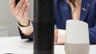 An Amazon Echo, center, and a Google Home, right, are displayed in New York, June 14, 2018.