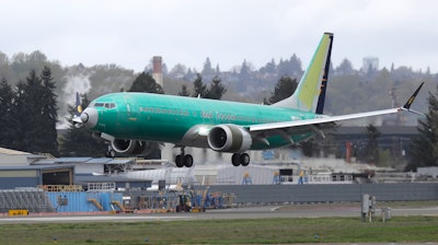 A Boeing 737 Max 8 airplane lands following a test flight at Boeing Field in Seattle, April 10, 2019.