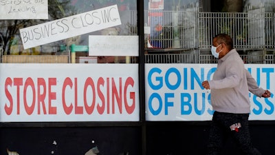 Signs at a closed store in Niles, Ill., May 21, 2020.