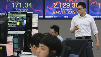 A currency trader at KEB Hana Bank headquarters in Seoul, June 3, 2020.