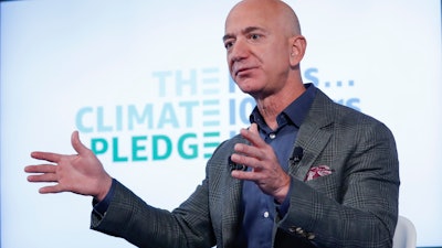 Amazon CEO Jeff Bezos arrives at a news conference at the National Press Club, Washington, Sept. 19, 2019.