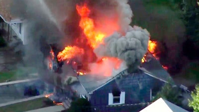 In this image taken from video provided by WCVB in Boston, flames consume a home of Lawrence, Mass., Sept. 13, 2018.