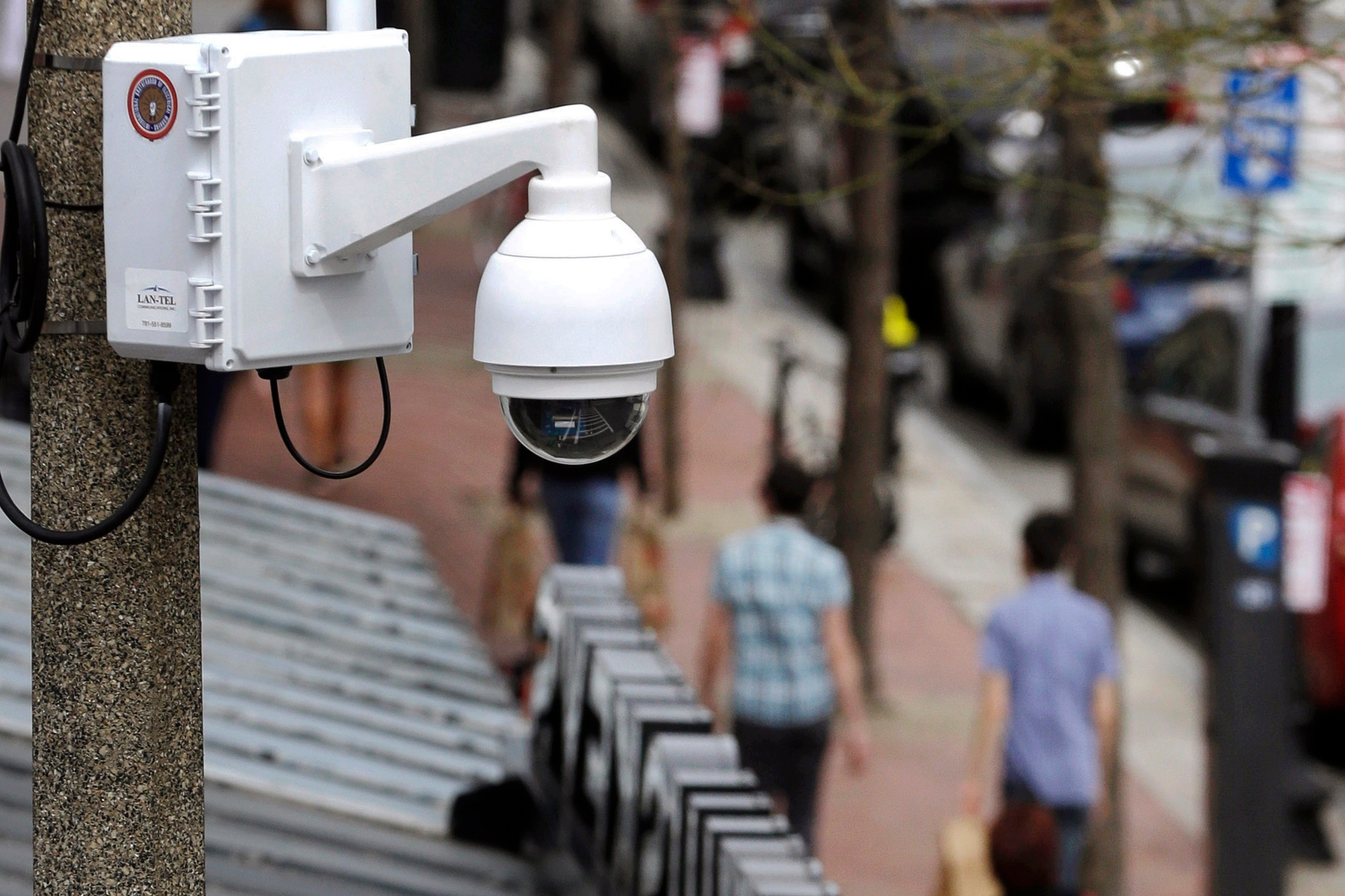 In this April 14, 2014, file photo, a surveillance camera is attached to a light pole along Boylston Street in Boston. The Boston City Council voted unanimously, Wednesday, June 24, 2020, to pass a ban on the use of facial recognition technology by city government.