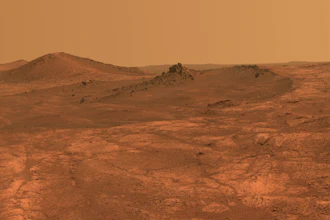 A composite of March 2015 photos shows a shallow crater on Mars called Spirit of St. Louis.
