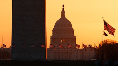 The Washington Monument and U.S. Capitol at sunrise, March 18, 2020.