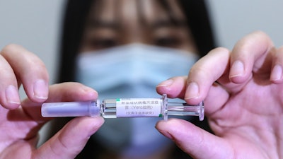 A sample of a potential COVID-19 vaccine at a SinoPharm plant in Beijing, April 10, 2020.