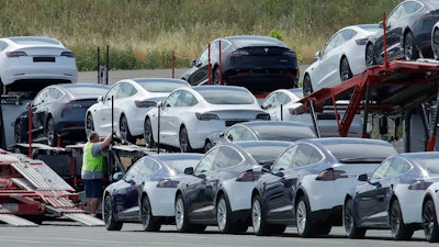 Cars loaded onto carriers at the Tesla plant in Fremont, Calif., May 13, 2020.