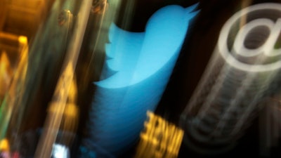 Twitter logo on an updated phone post on the floor of the New York Stock Exchange, Nov. 6, 2013.