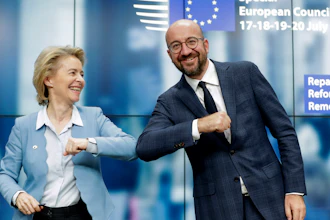 European Commission President Ursula von der Leyen, left, and European Council President Charles Michel bump elbows after addressing a media conference at an EU summit in Brussels, July 21, 2020.