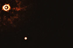 The star TYC 8998-760-1, upper left, and one of two giant exoplanets, July 2020.
