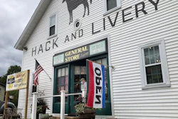 A man wearing a mask leaves a gift shop in Hope Valley, R.I., July 15, 2020.