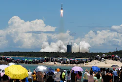 Spectators watch the Long March-5 rocket, carrying the Tianwen-1 Mars probe, lift off from the Wenchang Space Launch Center, July 23, 2020.