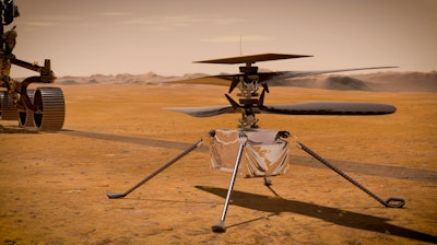 This illustration made available by NASA depicts the Ingenuity Mars Helicopter on the red planet's surface near the Perseverance rover, left.