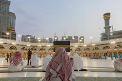 Pilgrims pray around the Kaaba, the square structure in the Great Mosque, Mecca, Saudi Arabia, July 26, 2020.