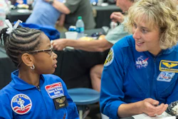 NASA astronaut Dottie Metcalf-Lindenburger talks with Space Camp camper Bria Jackson of Atlanta before giving a speech at the U.S. Space & Rocket Center in Huntsville, Ala., July 13, 2018.