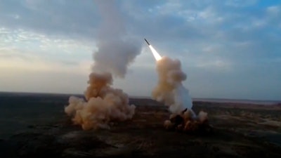 A video grab showing the launch of underground ballistic missiles by the Iranian Revolutionary Guard during a military exercise.