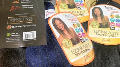 Samples of Pre-stretched Innocence EZBRAND Professional Antibacterial Braid hair extensions from I&I Hair Corporation, purchased in May, are seen in this photo in New York on Wednesday, July 1, 2020. Federal authorities in New York on Wednesday seized a shipment of weaves and other beauty accessories from I&I and other importers suspected to be made out of human hair taken from people locked inside a Chinese internment camp.