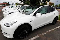 In this Sunday, June 28, 2020 file photo, 2020 Model Y electric sports-utility vehicles sit in the parking lot of a Tesla store in Littleton, Colo. Tesla overcame a seven-week pandemic-related shutdown at its U.S. assembly plant to post a $104 million net profit for the second quarter.