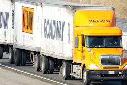 In this Feb. 2, 2010, file photo, a Yellow Freight/Roadway Express truck travels east on I-70, near Lecompton, Kan. The struggling trucking company once sued by the Department of Defense is getting a $700 million loan from the U.S. government because it is “critical to maintaining national security,” the Treasury Department said Wednesday, July 1, 2020. U.S. taxpayers will take a 29.6% stake in YRC Worldwide as a result of the deal, which was made as part of the Coronavirus Aid, Relief, and Economic Security Act.