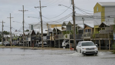 An SUV travels down Breakwater Drive in New Orleans, La., July 12, 2019.