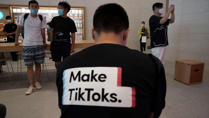 A man wearing a shirt promoting TikTok at an Apple store in Beijing, July 17, 2020.
