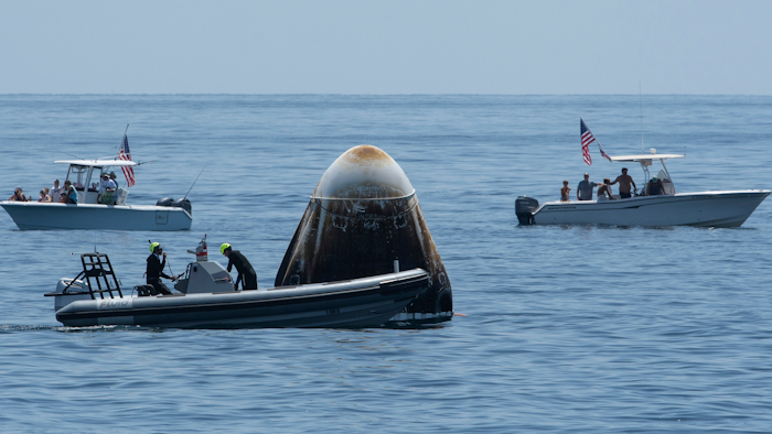 Support teams and curious boaters after the SpaceX Crew Dragon Endeavour spacecraft landed off the coast of Pensacola, Fla., Aug. 2, 2020.