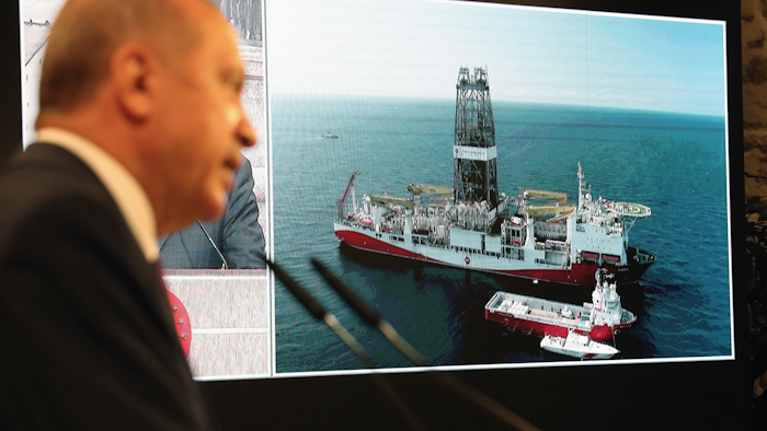Turkish President Recep Tayyip Erdogan, with the drilling ship Fatih in the background, in Istanbul, Aug. 21, 2020.