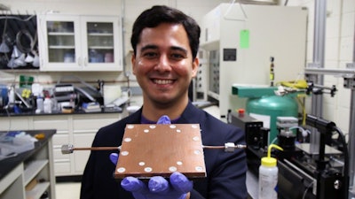 Lab member Mojtaba Edalatpour shows the thermal diode developed by Boreyko's team.