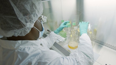 A researcher tests possible COVID-19 antibodies in a laboratory in Indianapolis, May 2020.