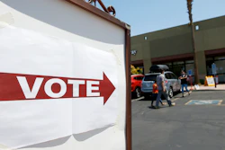 Voters walk to a polling station to cast votes in Arizona's primary, Aug. 4, 2020, Chandler, Ariz.