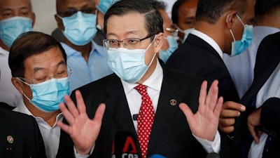 Former finance minister Lim Guan Eng speaks to media outside a courthouse in Kuala Lumpur, Aug. 7, 2020.