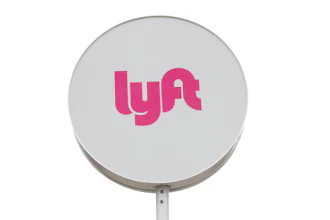 Lyft sign at a shared ride pickup location in Detroit, March 24, 2020.
