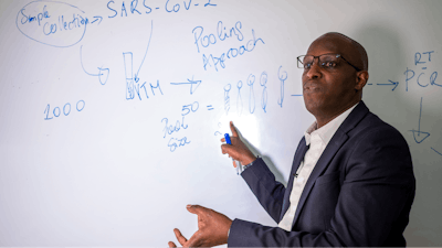 Leon Mutesa, Rwandan professor of human genetics and a member of the government's COVID-19 task force, explains the pooled testing procedures at the Rwanda Biomedical Center in Kigali, July 28, 2020.