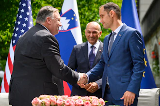 U.S. Secretary of State Mike Pompeo, left, and Slovenia's Foreign Minister Anze Logar shake hands as Slovenia's Prime Minister Janez Jansa stands at center, Bled, Slovenia, Aug. 13, 2020.