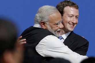 Facebook CEO Mark Zuckerberg hugs Indian Prime Minister Narendra Modi at Facebook, Menlo Park, Calif., Sept. 27, 2015.