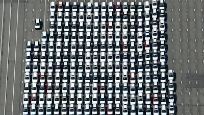 Vehicles parked at a logistics center in Kawasaki, Japan, Aug. 17, 2020.
