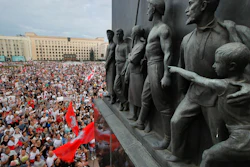 Protest rally in Minsk, Belarus, with Soviet-era sculptures in the foreground, Aug. 18, 2020.
