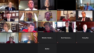 An Associated Press computer screen capture shows the Kansas State Board of Education meeting by Zoom with staff members and other state officials watching, July 22, 2020, Topeka, Kan.