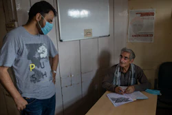 Parvez Imroz, right, a prominent Kashmiri human rights lawyer, talks to Khurram Parvez, an official of the Jammu-Kashmir Coalition of Civil Society, inside their office in Srinagar, Tuesday, Aug. 25, 2020.