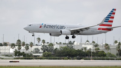 An American Airlines Boeing 737-823 lands at Miami International Airport, July 27, 2020.