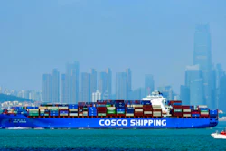 A China COSCO Shipping container ship sails past the skyline of Qingdao in eastern China's Shandong Province, on July 28, 2020. China's exports rose 7.2% in July over a year earlier despite the coronavirus pandemic. Sales to the United States rose 12.5% despite lackluster U.S. economic activity and lingering tariff war with Washington.