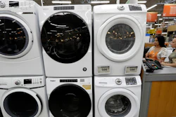 In this Sept. 23, 2019 file photo, clothes dryers are stacked on top of washing machines at a Home Depot store location, in Boston.