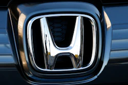 In this Jan. 11, 2016, file photo, the logo of Honda Motor Co. is seen on a Honda vehicle at the Japanese automaker's headquarters in Tokyo. Honda, on Tuesday, Aug. 4, 2020, is recalling over 1.6 million minivans and SUVs in the U.S. to fix problems that include faulty backup camera displays, malfunctioning dashboard lights and sliding doors that don’t latch properly. They cover certain Odyssey minivans from 2018 to 2020, Pilot SUVs from 2019 through 2021 and Passport SUVs from 2019 and 2020.