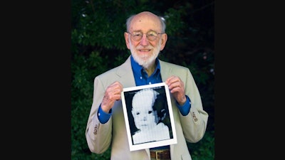 In this 2007 file photo, Russell Kirsch holds the image of his son, Walden, that was scanned into the world's first digital scanner in 1957.